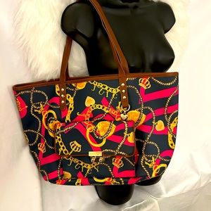 Juicy Couture shoulder bag. Dark blue background with pink and yellow vintage